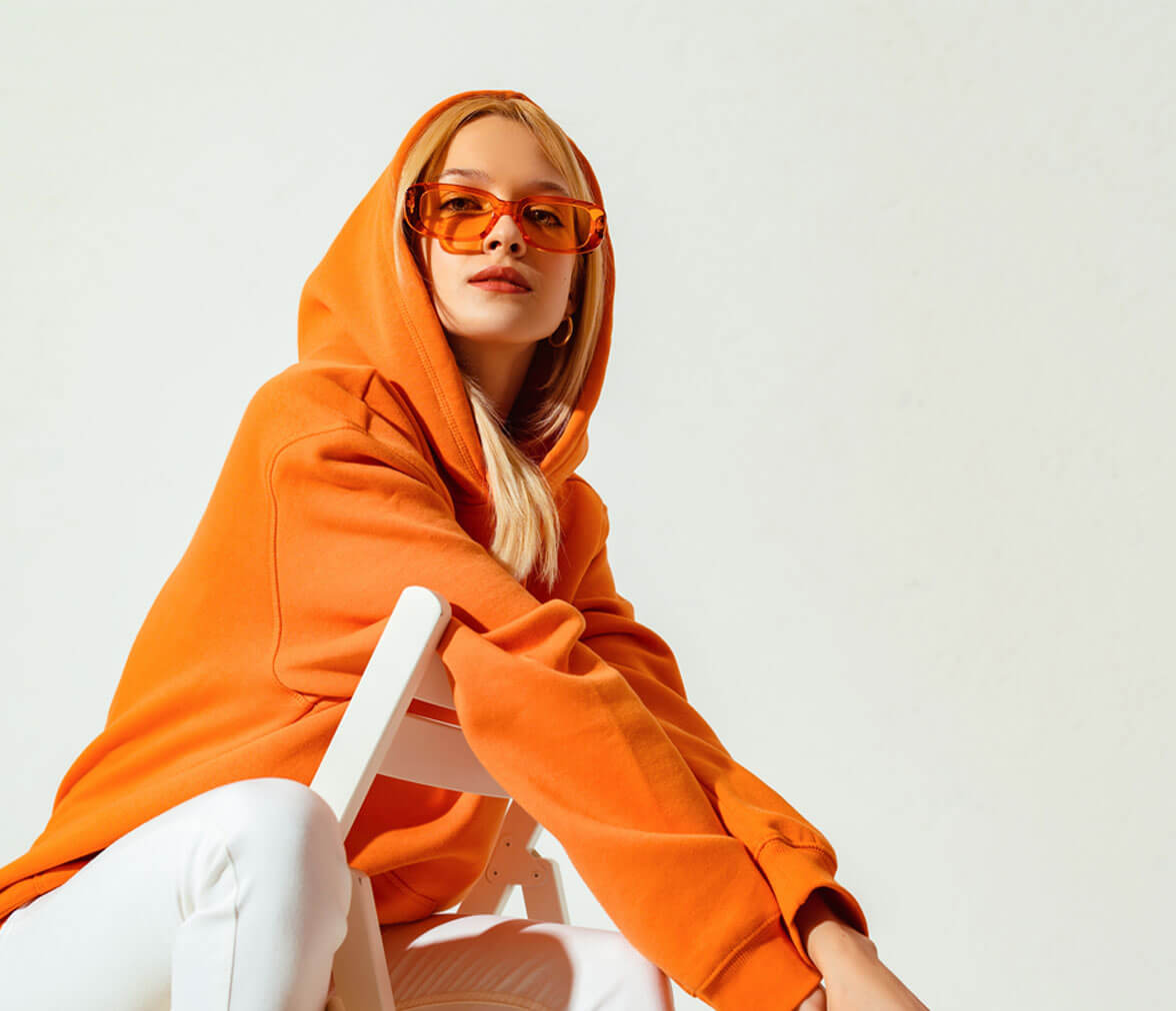 Woman with orange hoodie