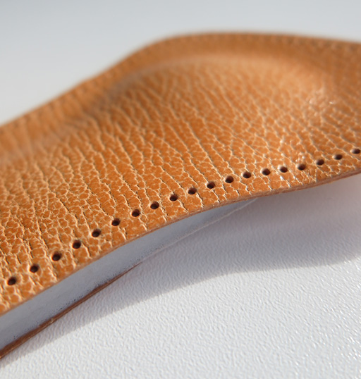 Cushioning insole for pumps